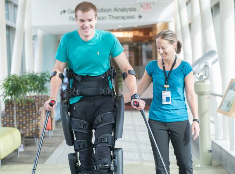 Gillette spinal cord injury patient Jackson working with physical therapist in skyway