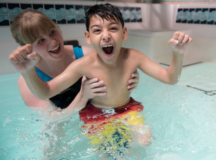 Gillette children's patient, Masood, during aquatic pool therapy