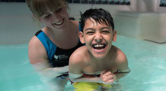 Gillette children's patient Masood during aquatic pool therapy.