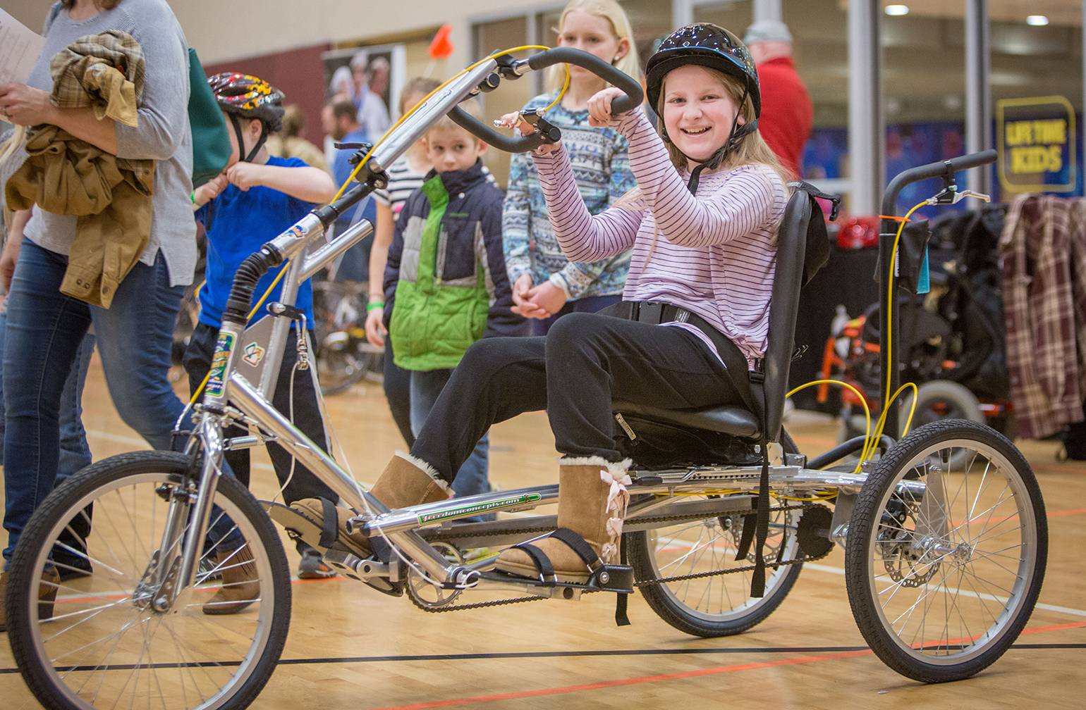 Gillette patient tries out adaptive bike during bike expo