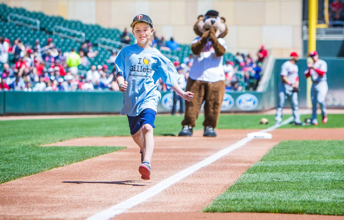 Gillette patient Wyatt runs the bases at Twins game
