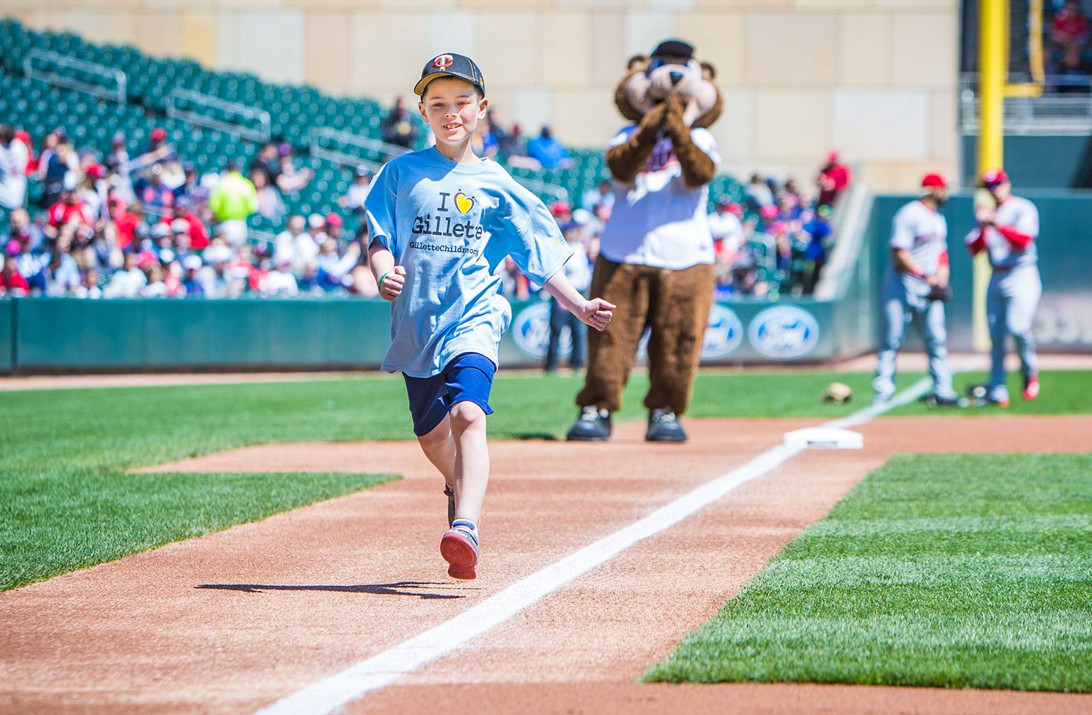 Gillette patient Wyatt runs the bases at Twins game