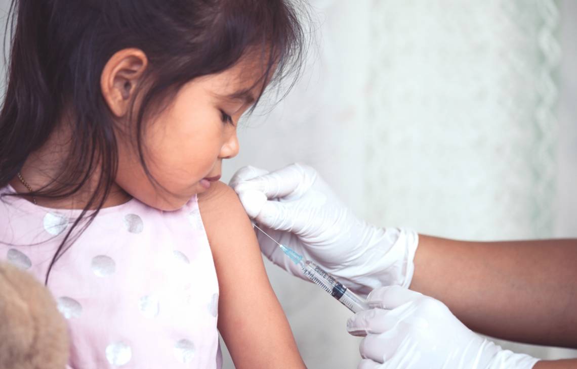 Little girl getting flu vaccine