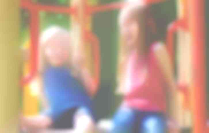 Two little girls on the playground