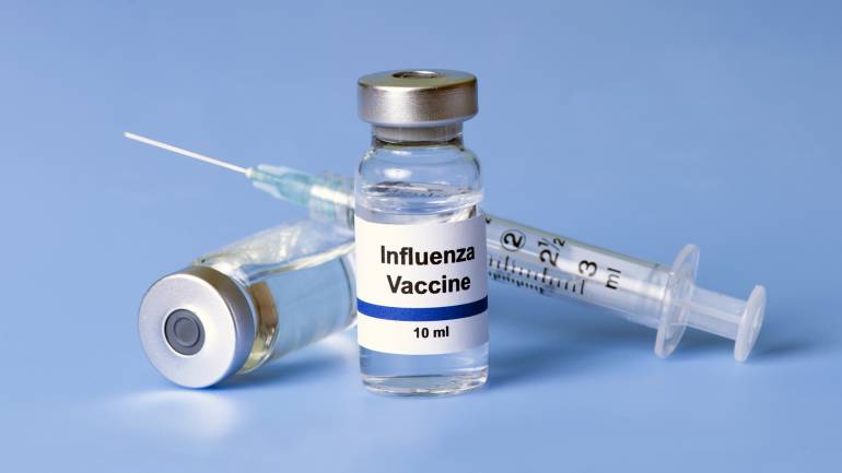 flu vaccine and needle