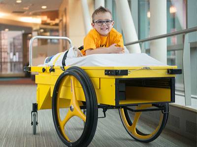 Brock spent time on the Gillette Prone Cart during recovery from rhizotomy surgery.