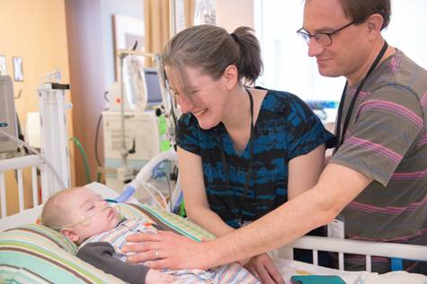 Felix with his mom and dad in Gillette children's PICU