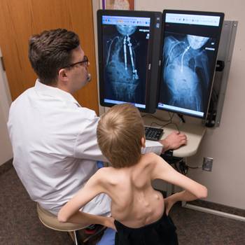 After examining Joshua, Tenner Guillaume, MD, recommended a pioneering scoliosis treatment.
