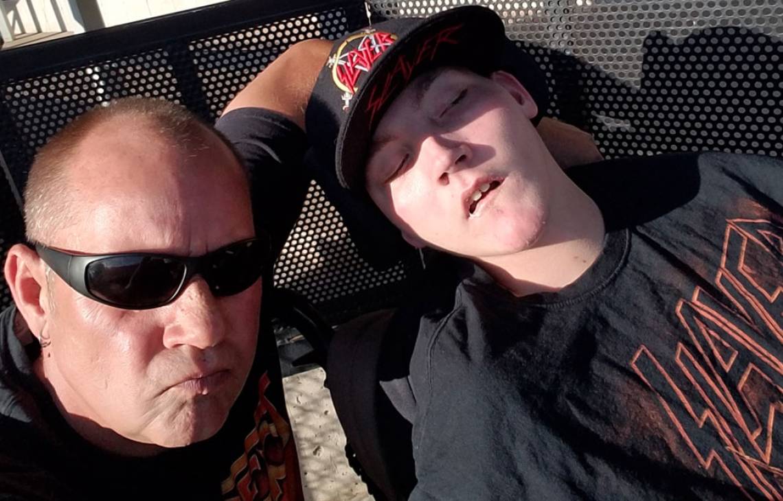 Gillette patient Mason with his dad on mission to see 500 bands.